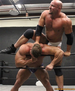 Brute chokes Johnny Bravo on the ropes big arms biceps pecs