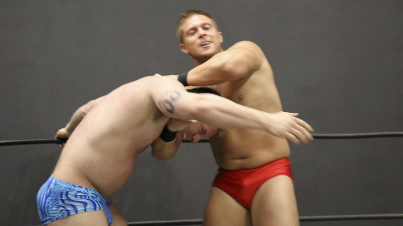 Bucky puts Talon in a headlock