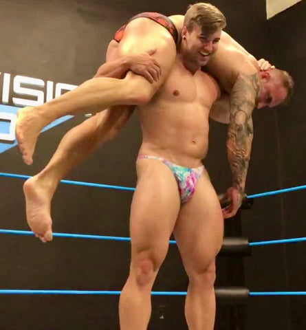 Loki puts Bull into a fireman carry at Thunders Arena Wrestling. 
