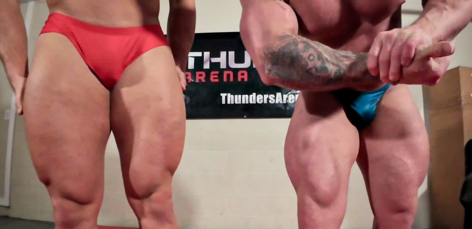 Bodybuilders flexing quads
