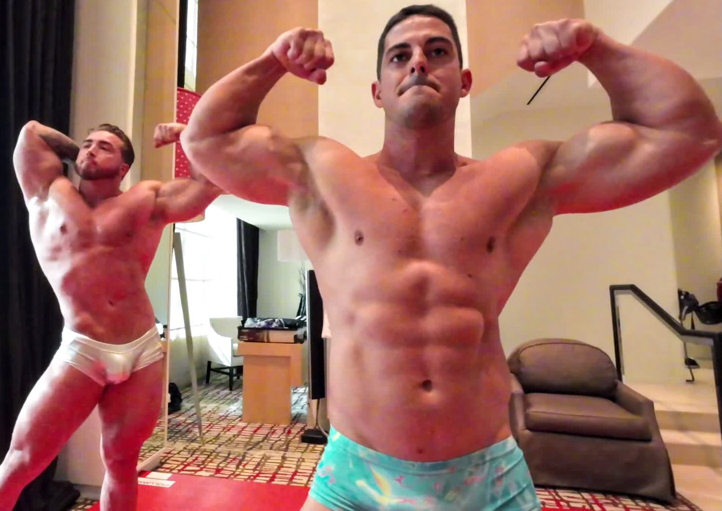 Double biceps bodybuilders posing