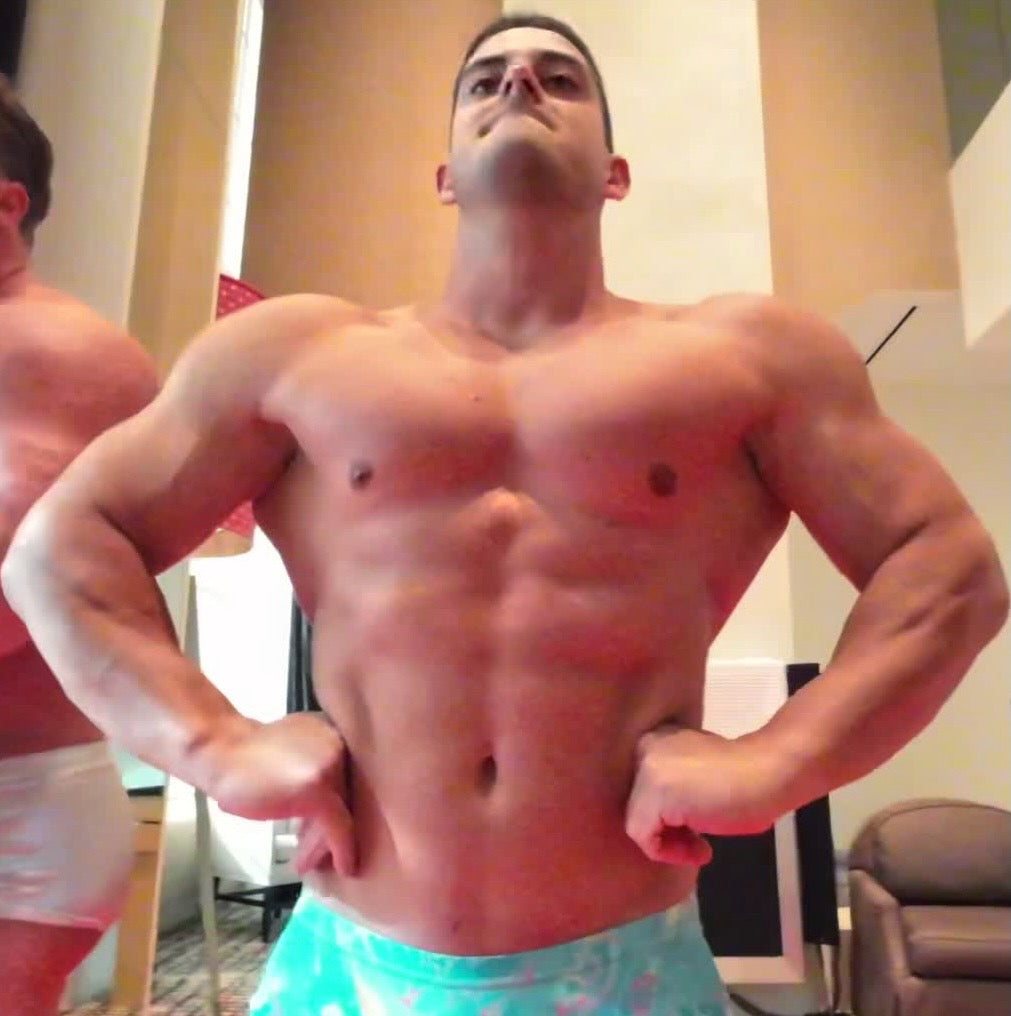 bodybuilder flexing abs pecs