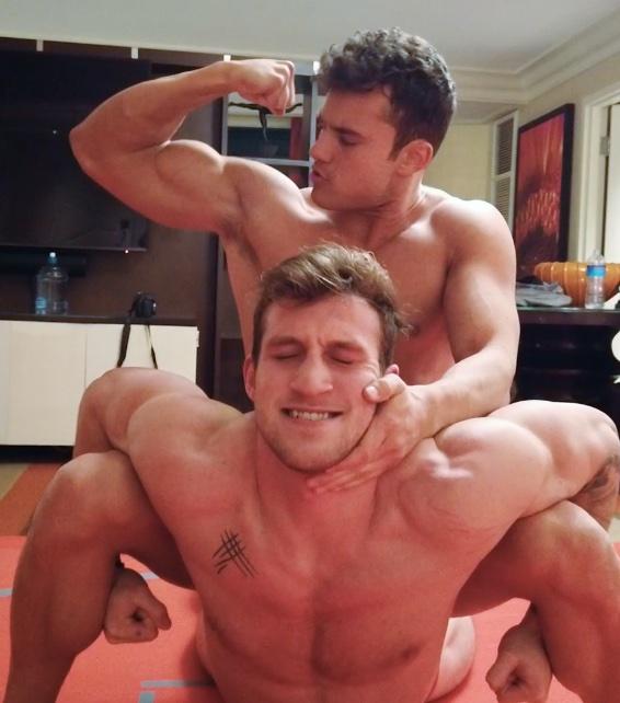 Caffrey putting Cason into a Camel Clutch while bicep flexing