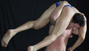 Lupe lifts Zman in the air with an amazing firemans carry in Thunders Arena