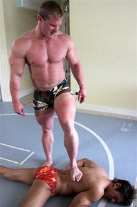 Luger dominates Zman and stands victoriously over him in Thunders Arena