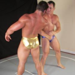 Frank the Tank and Ace Hanson pose and flex pecs, arms, abs, back, thighs, and traps