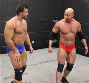Brian Cage and Brute square up pecs chest arms