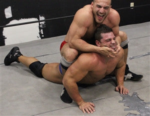 Dirty Daddy camel clutch on Brian Cage arms biceps