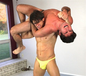 Zman lifts Mogly into a vicious torture rack submission hold in Thunders Arena