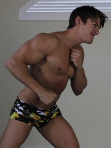 Zman flexes and measures for a gut punch in Thunders Arena