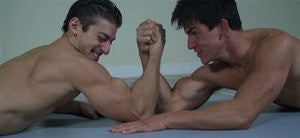 Man and Cody arm wrestle bicep flex on mat big biceps arms