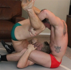 Marco head scissors Tak grapple wrestle