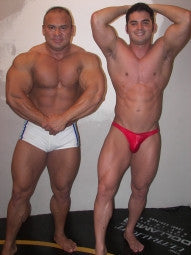 Gman Batar flexing pecs chest arms biceps abs thighs