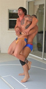 Big Sexy Dozer bearhug lift carry thighs tattoos chest