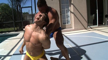 Johnny Bravo punishes Zmans pecs and arms with a submission hold in Thunders Arena