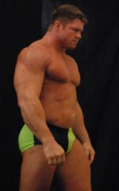 Johnny Bravo bodybuilder flex pose chest pecs abs arms