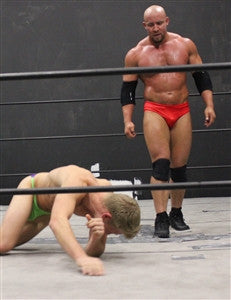 Brute towers over TAK after match pecs thighs wrestling