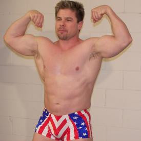 Mr. Bruce double bicep flex arms pecs chest abs