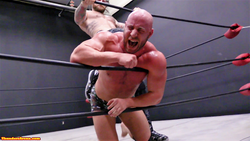 Viking pins Brute against the ropes at Thunders Arena Wrestling 