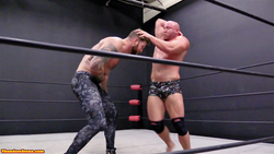 Brute elbows Viking in the head at Thunders Arena Wrestling 