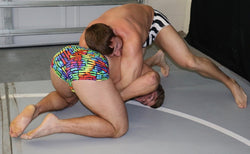 Billy The Kid wrestling hold Frey in a waistlock at Thunders Arena