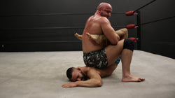 Brute puts Kid Romeo into a boston crab on Thunders Arena Wrestling. 