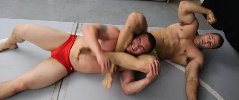 Adam Bryant squeezed by Vinny at Thunders Arena in a headscissors