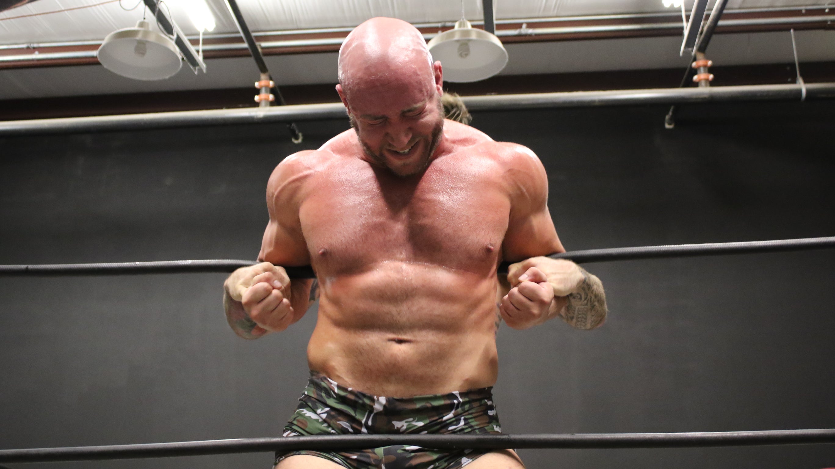 Viking presses Brute against the ropes on thunders arena 