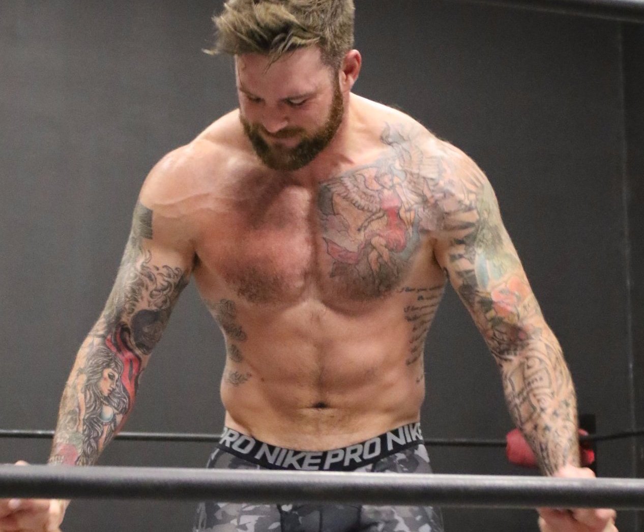 Viking puts Brute into a head scissors on thunders arena  