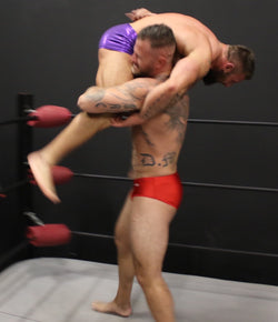 Mack throws Tank over his shoulder in a firemen carry at Thunders Arena Wrestling.