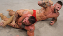 Mack puts Tank in a body scissor at Thunders Arena Wrestling