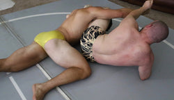 muscular men wrestling