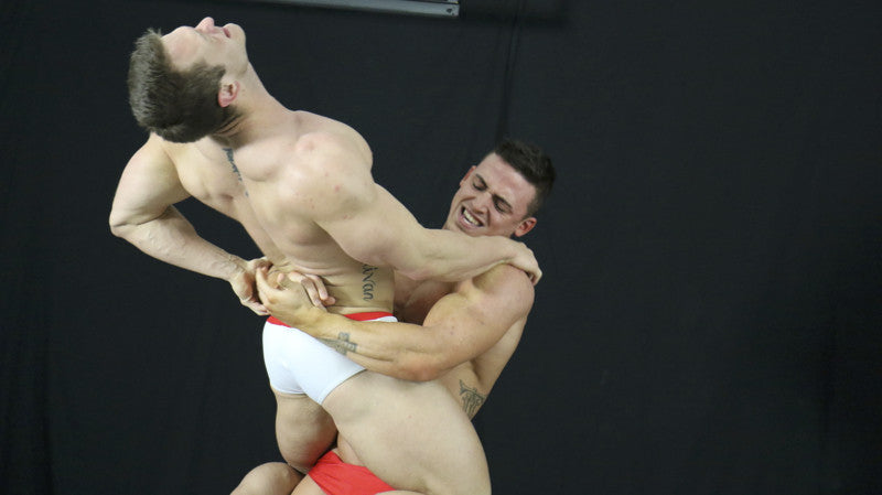Steel (Joey Sullivan) suffers in Marco's crushing bear hug.