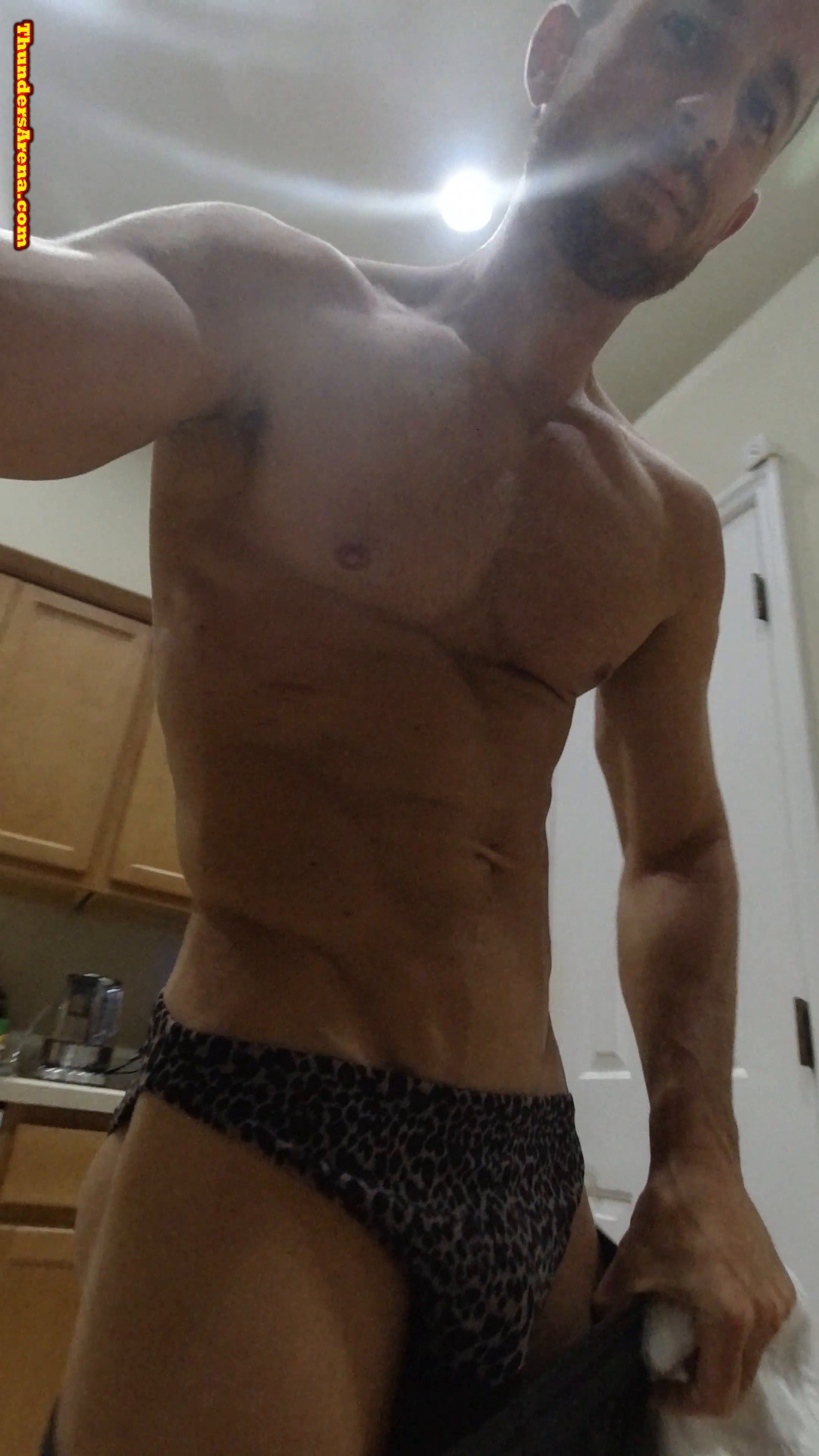 Brix stripping his clothes before the match