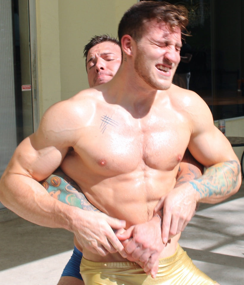 Hero bear hugging Cason from behind