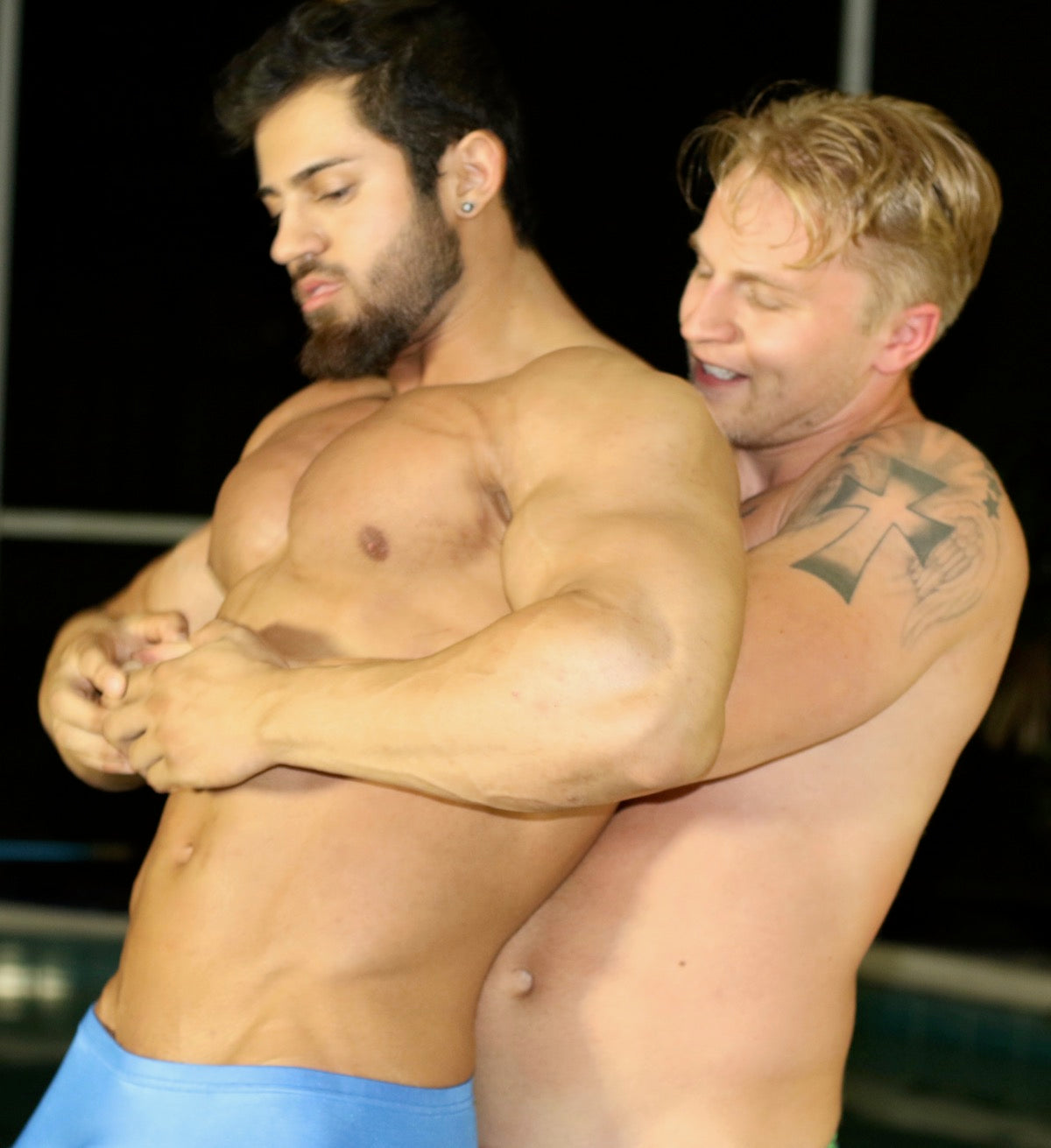 Iceman18 puts Sergei into a bear hug at Thunders Arena Wrestling. 