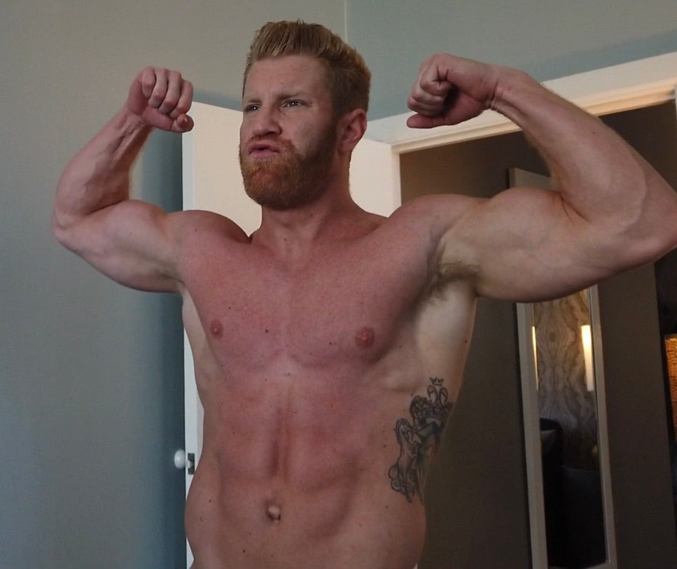 Johnny V. double bicep flexing