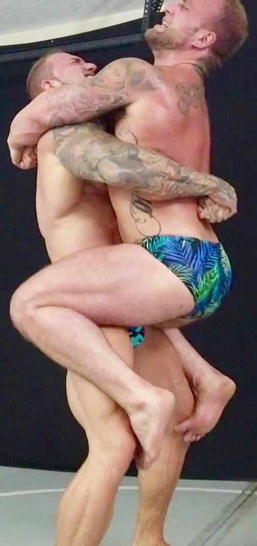 Bull and Gunnar bearhug each other at Thunders Arena Wrestling.