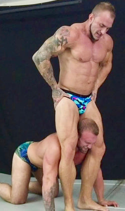 Bull puts Gunnar in a head scissors at Thunders Arena Wrestling. 