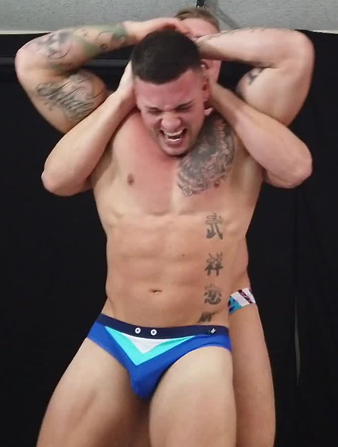 Texas puts Hero into a full nelson at Thunders Arena Wrestling.