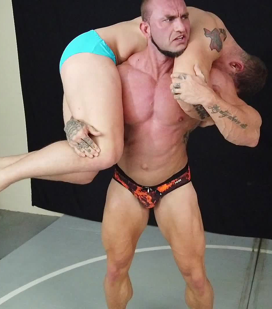 Bull puts Kevlar into a fireman's carry at Thunders Arena Wrestling. 