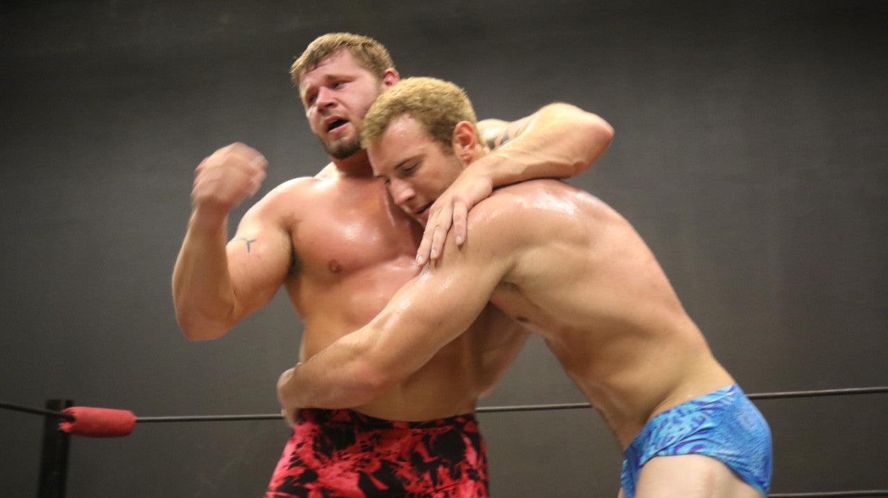 Talon attempting to put Beast in a bearhug