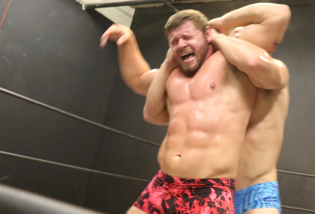 Talon has Beast in a full nelson abs