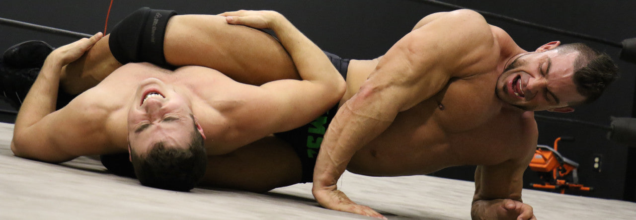 Brian Cage body scissors Bolt big arm tricep