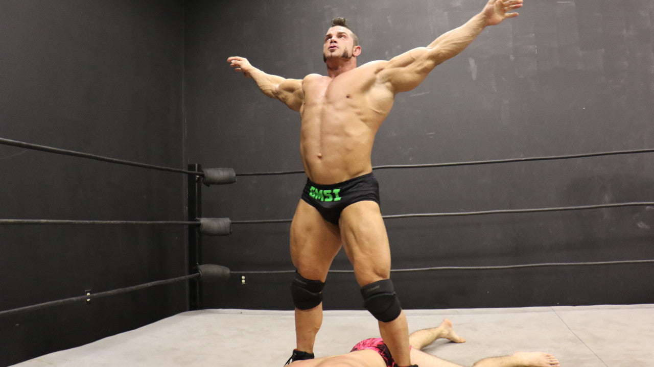 Brian Cage victory pose over Bolt bodybuilder arms abs pecs