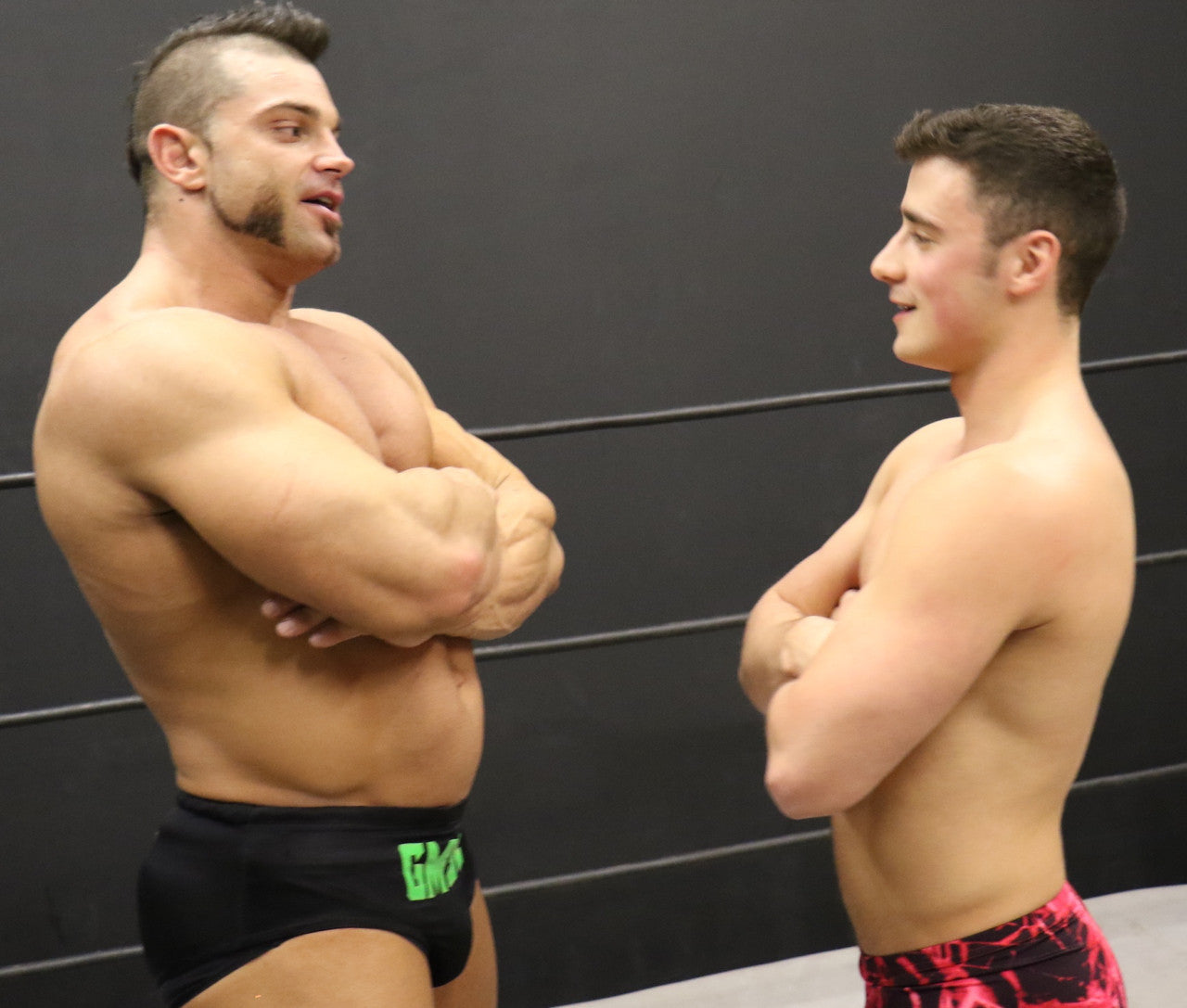 Brian Cage and Bolt square up big arms