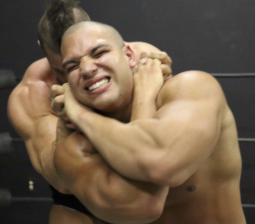 Brian Cage head lock on Dozer back