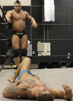 Brian Cage towers over Eagle in the corner