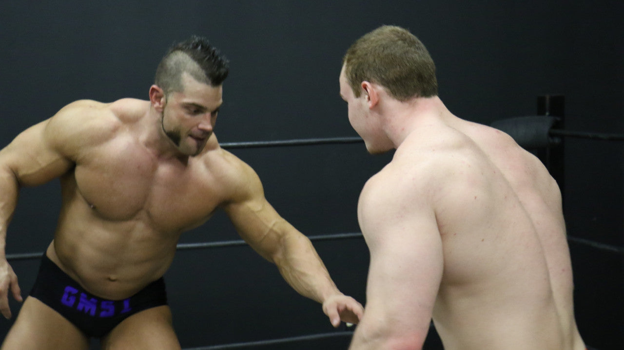 Brian Cage and Travis square up pecs big arms