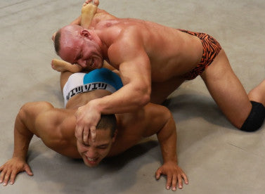 Brute bashes Dozer's head on the mat Dozer